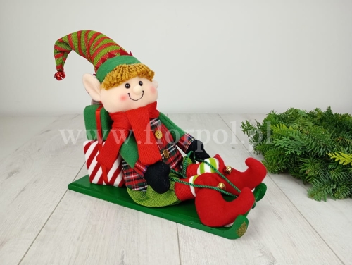 pluszowy elf na sankach 1szt zielone sanki